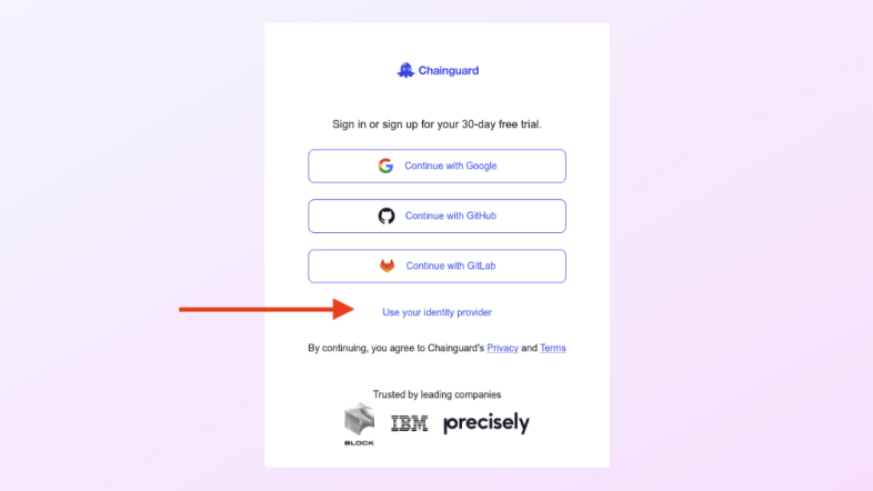 Screenshot showing an example Chainguard login page, with a red arrow pointing to the &ldquo;Use your identity provider&rdquo; link.